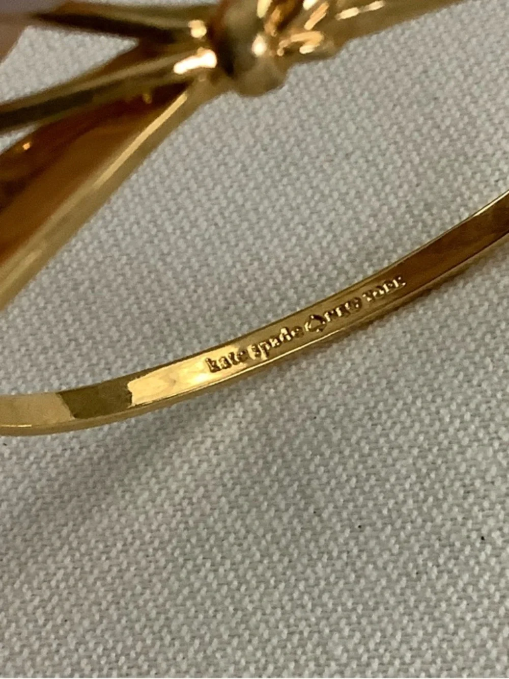 kate spade gold-tone bow hinged bangle bracelet